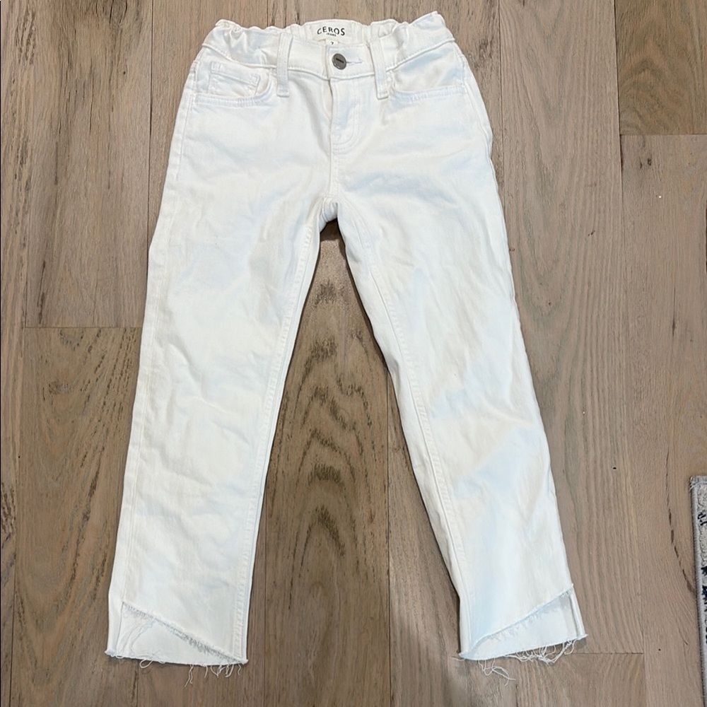 Stylish Kids White Jeans w/ diagonal hem and adjustable waist.
